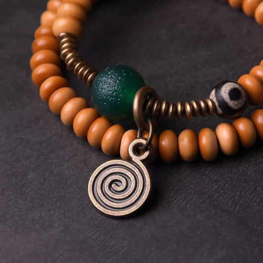 Bracelet Noyaux d'Olive et Onyx Vert avec Perle Œil de Bouddha – Tibétain Écologique