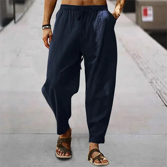 Pantalon ample en coton et lin bleu marine, matière respirante et style décontracté estival.