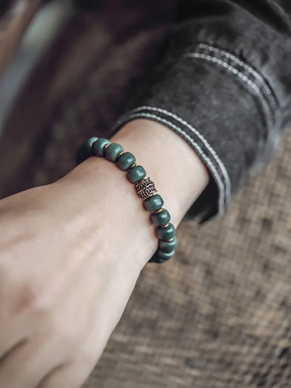 Bracelet Graines de Bodhi Vertes et Laiton – Bijou Zen Porte-Bonheur