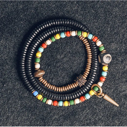 Bracelet Tibétain Perle Dzi, Ébène et Verre Coloré – Vajra en Cuivre Martelé