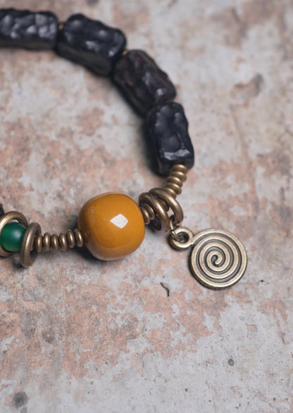 Bracelet Ébène Sculptée et Agate de Gobi – Breloque en Cuivre, Bijou de Couple