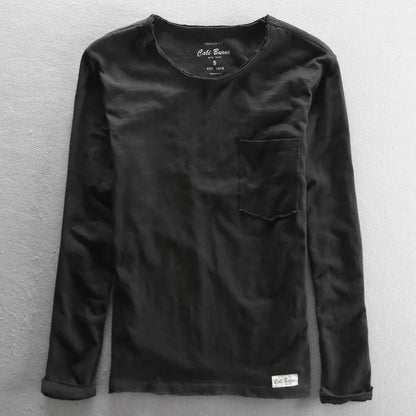 T-shirt vintage manches longues en coton noir, col rond et coupe décontractée, présentation à plat.