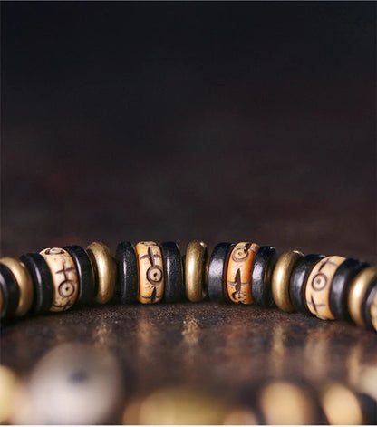 Bracelet Tibétain Os de Bœuf Sculpté et Ébène – Perle Œil Protecteur, Unisexe