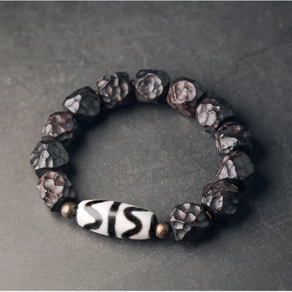 Bracelet Tibétain Ébène et Perle Dzi – Amulette de Protection en Cuivre Martelé