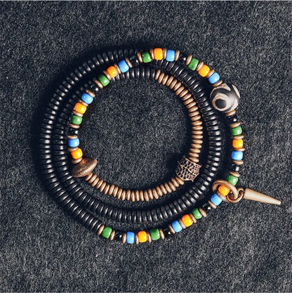 Bracelet Tibétain Perle Dzi, Ébène et Verre Coloré – Vajra en Cuivre Martelé
