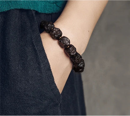 Bracelet Tibétain Ébène et Perle Dzi – Amulette de Protection en Cuivre Martelé