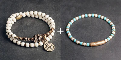 Bracelet Tibétain Multirang Os de Yak et Verre de Murano – Breloque en Laiton Martelé