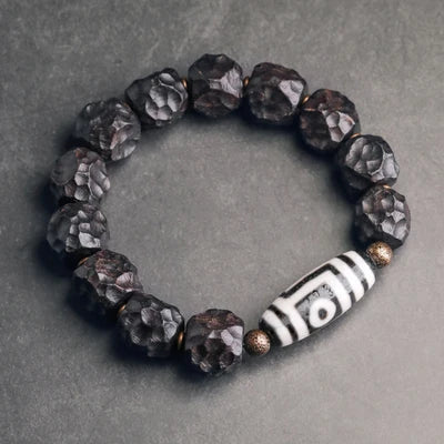 Bracelet Tibétain Ébène et Perle Dzi – Amulette de Protection en Cuivre Martelé
