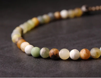 Bracelet Jade Jaune ou Jaspe Rouge avec Breloque Trèfle – Porte-Bonheur pour Femme