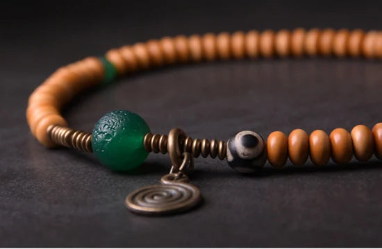 Bracelet Noyaux d'Olive et Onyx Vert avec Perle Œil de Bouddha – Tibétain Écologique