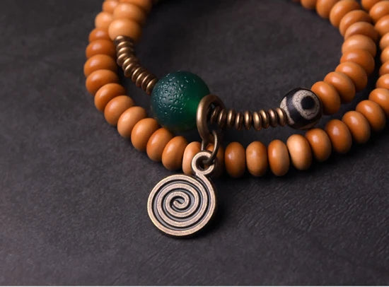 Bracelet Noyaux d'Olive et Onyx Vert avec Perle Œil de Bouddha – Tibétain Écologique