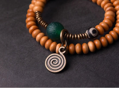 Bracelet Noyaux d'Olive et Onyx Vert avec Perle Œil de Bouddha – Tibétain Écologique