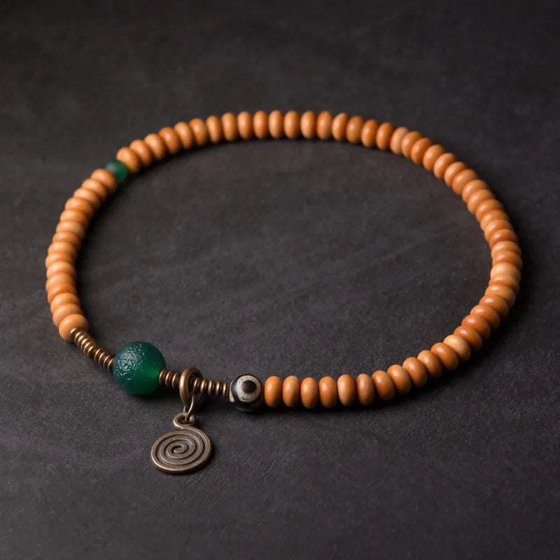 Bracelet Noyaux d'Olive et Onyx Vert avec Perle Œil de Bouddha – Tibétain Écologique