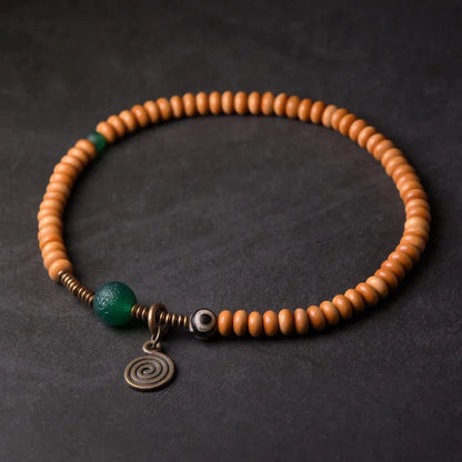 Bracelet Noyaux d'Olive et Onyx Vert avec Perle Œil de Bouddha – Tibétain Écologique