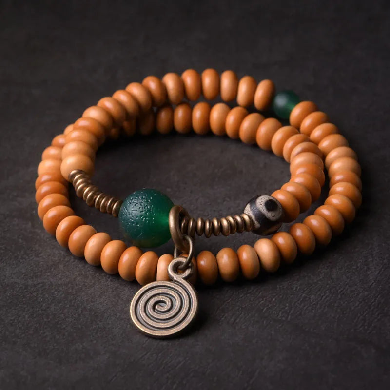 Bracelet Noyaux d'Olive et Onyx Vert avec Perle Œil de Bouddha – Tibétain Écologique
