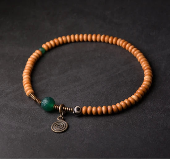 Bracelet Noyaux d'Olive et Onyx Vert avec Perle Œil de Bouddha – Tibétain Écologique