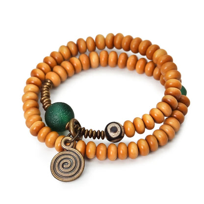 Bracelet Noyaux d'Olive et Onyx Vert avec Perle Œil de Bouddha – Tibétain Écologique