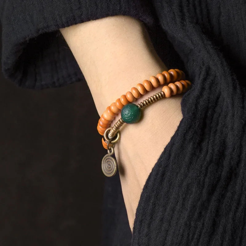 Bracelet Noyaux d'Olive et Onyx Vert avec Perle Œil de Bouddha – Tibétain Écologique