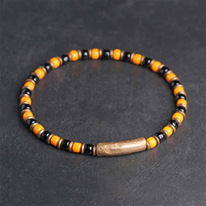 Bracelet Fin Perles de Verre à l'Ancienne et Breloque en Cuivre Martelé – Bohème Chic