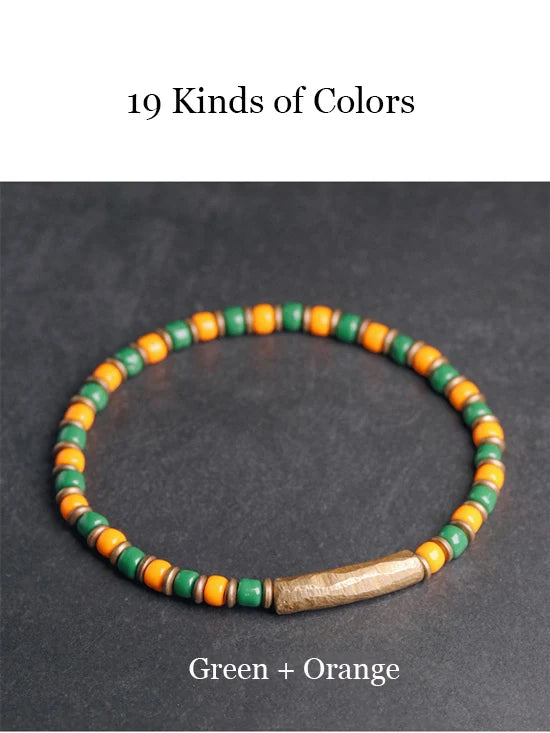 Bracelet Tibétain Multirang Os de Yak et Verre de Murano – Breloque en Laiton Martelé