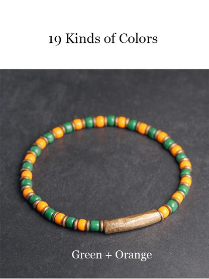 Bracelet Tibétain Multirang Os de Yak et Verre de Murano – Breloque en Laiton Martelé