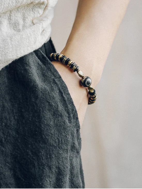 Bracelet Tibétain Os de Bœuf Sculpté et Ébène – Perle Œil Protecteur, Unisexe