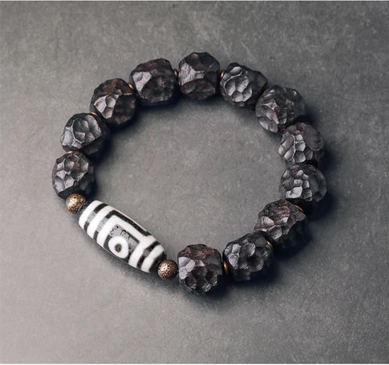 Bracelet Tibétain Ébène et Perle Dzi – Amulette de Protection en Cuivre Martelé