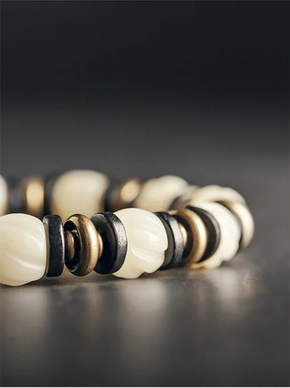 Bracelet de Prière Os Blanc Gravé et Intercalaires en Ébène – Œil Tibétain Protecteur
