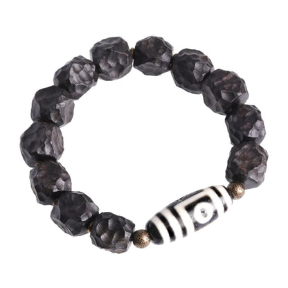 Bracelet Tibétain Ébène et Perle Dzi – Amulette de Protection en Cuivre Martelé