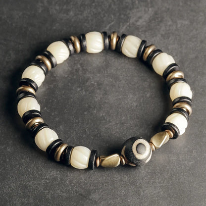 Bracelet de Prière Os Blanc Gravé et Intercalaires en Ébène – Œil Tibétain Protecteur