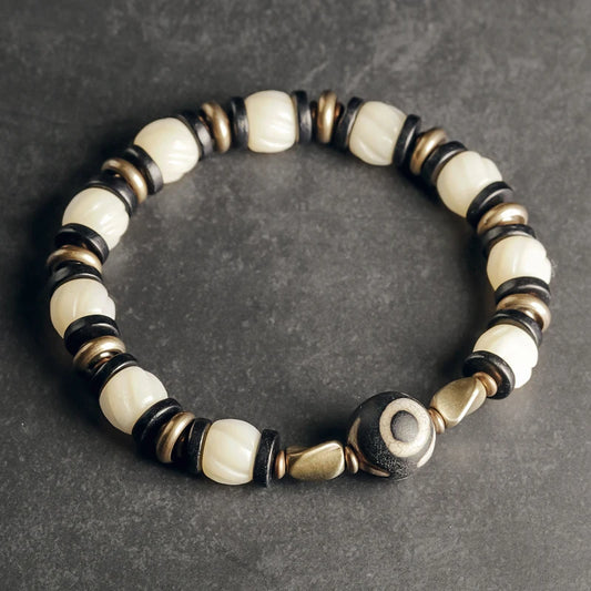 Bracelet de Prière Os Blanc Gravé et Intercalaires en Ébène – Œil Tibétain Protecteur