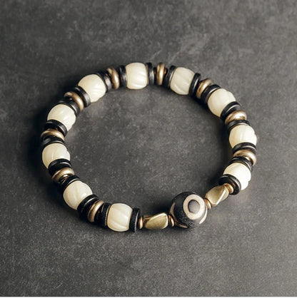 Bracelet de Prière Os Blanc Gravé et Intercalaires en Ébène – Œil Tibétain Protecteur