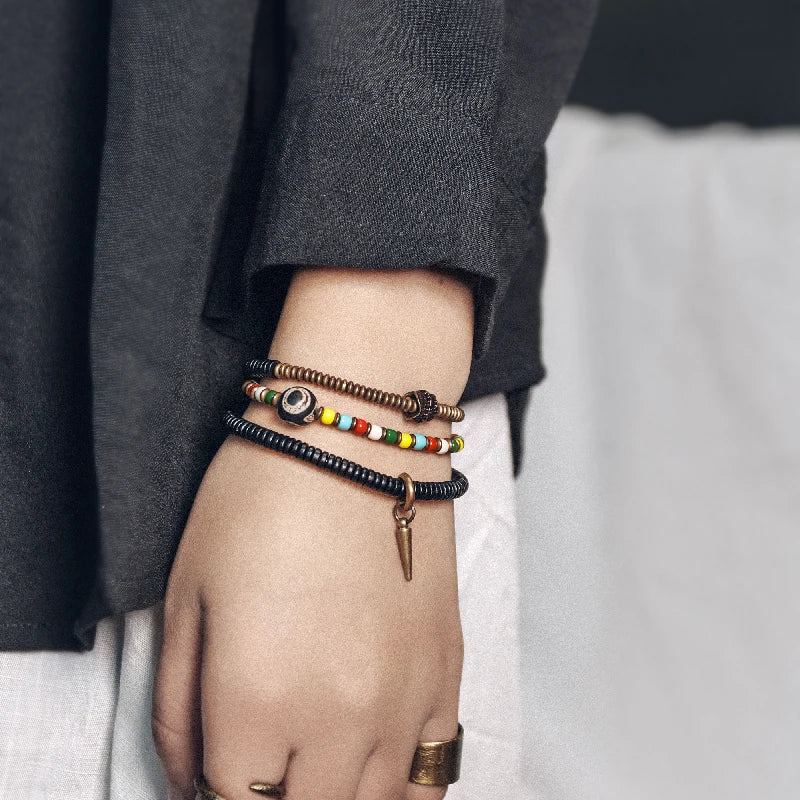 Bracelet Tibétain Perle Dzi, Ébène et Verre Coloré – Vajra en Cuivre Martelé