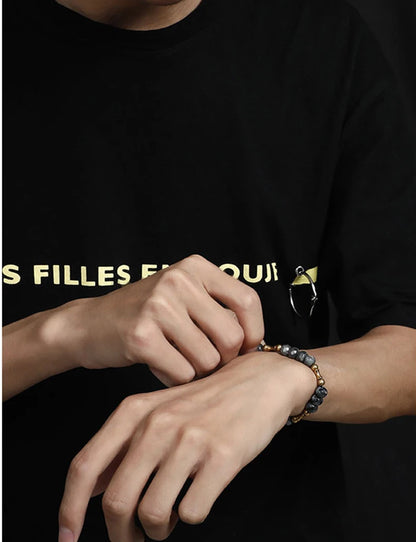 Bracelet Oeil de Tigre à Facettes ou Hornblende Noire – Breloque Bambou en Cuivre