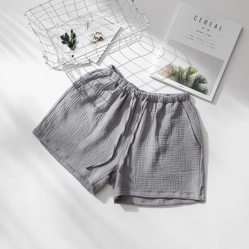 Short de pyjama gris en double gaze de coton, vue à plat montrant la matière légère et aérée.