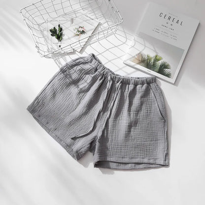 Short de pyjama gris en double gaze de coton, vue à plat montrant la matière légère et aérée.