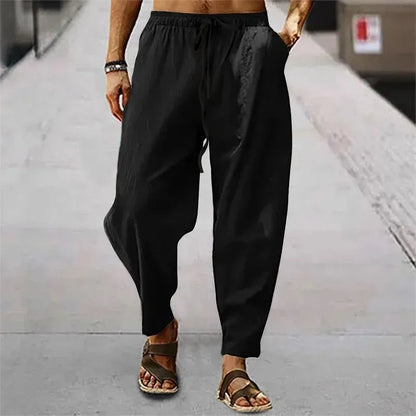 Pantalon zen noir en mélange lin, coupe sarouel moderne avec poches latérales et cordon.