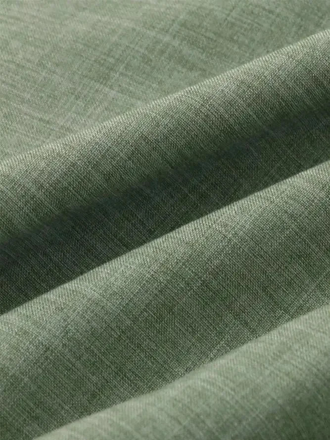 Zoom sur la texture naturelle respirante du mélange lin et coton, coloris vert chiné.
