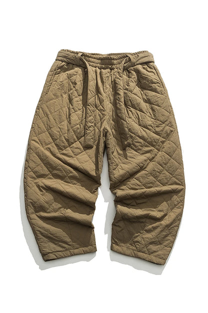 Pantalon sarouel d'hiver coloris kaki, texture matelassée chaude et ceinture à nouer.