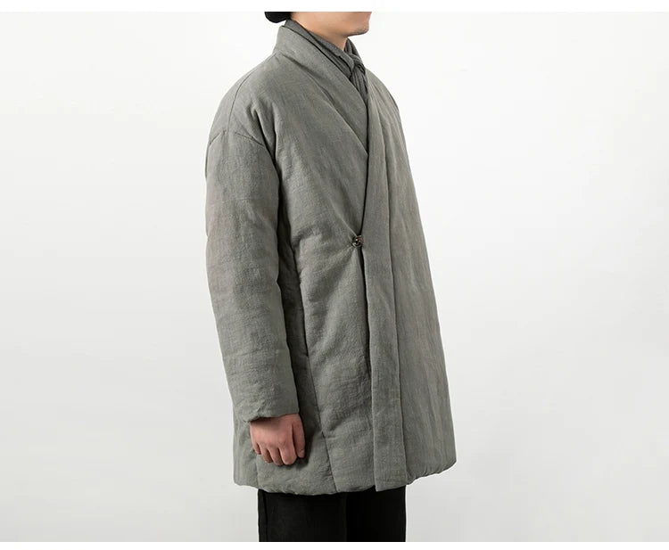 Gros plan sur la matière en lin naturel gris, révélant la texture authentique et le tissage.