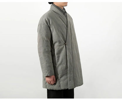 Gros plan sur la matière en lin naturel gris, révélant la texture authentique et le tissage.