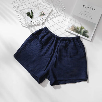 Bas de pyjama bleu marine en coton gaufré, style décontracté avec cordon ajustable pour un maintien optimal.