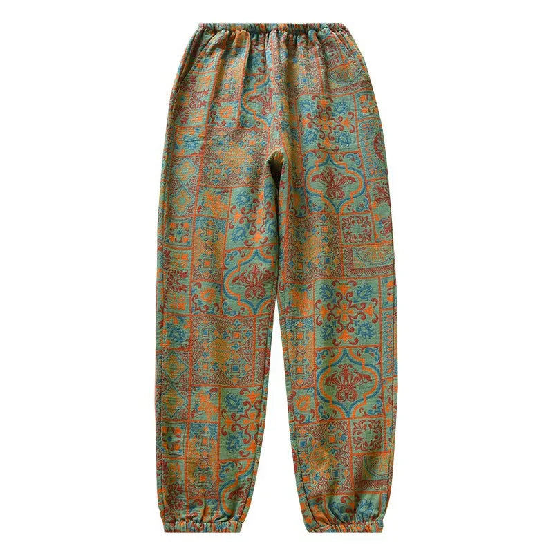 Pantalon de nuit ample vert à imprimé ethnique, vue de face sur fond blanc, taille et bas élastiqués.