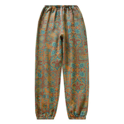 Pantalon de nuit ample vert à imprimé ethnique, vue de face sur fond blanc, taille et bas élastiqués.