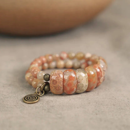 Bracelet Double Rang Pierre Corail et Laiton – Bijou Oriental de Prospérité