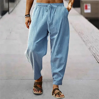 Pantalon gris anthracite en lin, coupe droite ample et taille ajustable, style minimaliste.