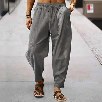 Pantalon large vert kaki en coton lin, design épuré et fluide, idéal pour un look décontracté.