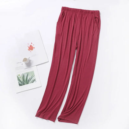 Bas de nuit vert foncé en modal, textile fluide et doux pour des nuits confortables en toute saison.