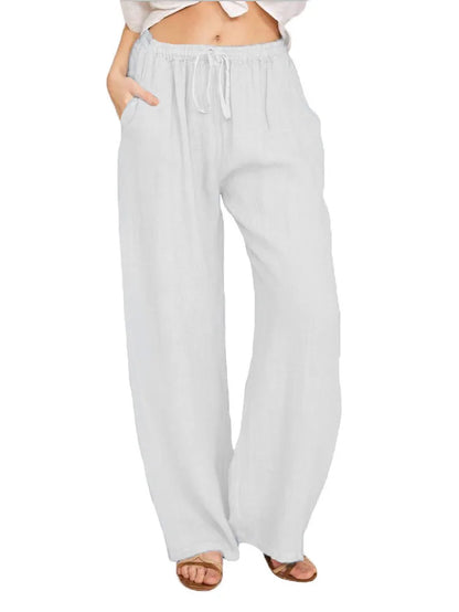 Pantalon fluide blanc en coton-lin, coupe ample et légère, idéal pour un look d'été zen et décontracté.